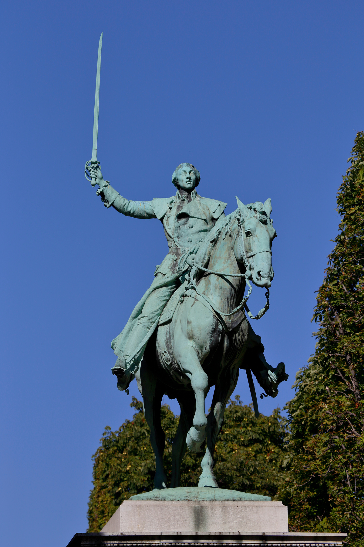 Statue of man on horse holding sword